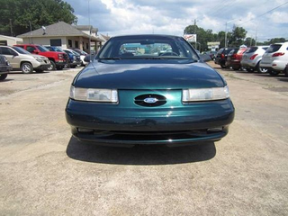 Illustration for article titled Used Car Face-Off: '90s American Performance Saloons